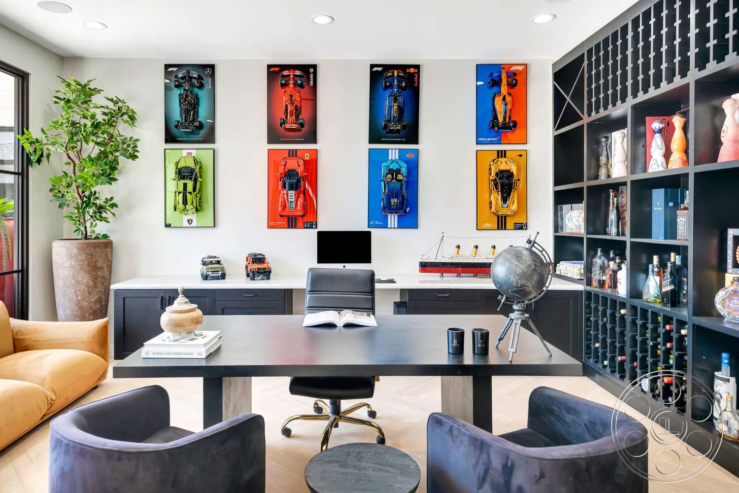 Modern 534 - dark wood cabinetry, white painted walls, interior office space, polished hardwood flooring, contemporary upholstered armchair, ambient track lighting, modern desk design, exotic plant in ceramic planter, framed automotive art wall decor, geometric bookshelves, globe decor on stand