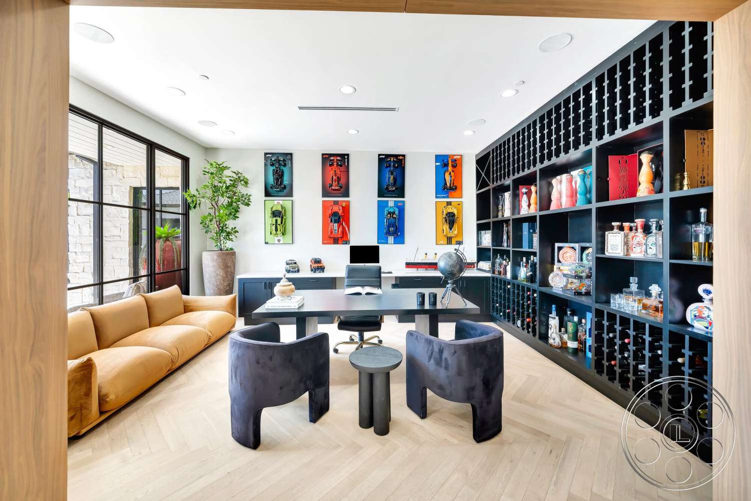 Modern 534 - neutral color palette, hardwood flooring, contemporary decor, indoor plants, decorative vases, black cabinetry, modern desk, large windows with black frames, chefs kitchen, herringbone hardwood floors, framed artwork display, curved velvet chairs, geometric shelving unit, glass globe