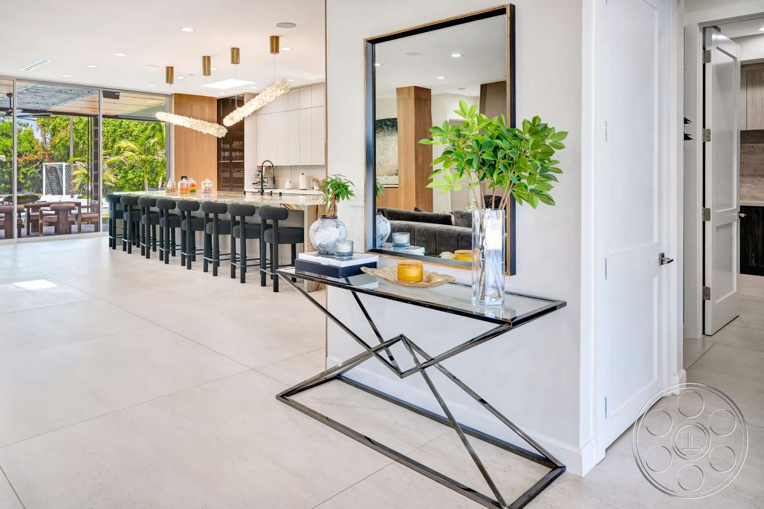 Modern 534 - dark wood cabinetry, neutral color palette, contemporary decor, concrete flooring, open concept layout, modern pendant lighting, floor-to-ceiling windows, lush indoor plants, rectangular kitchen island, minimalist design aesthetic, white painted walls, glass table with black metal base