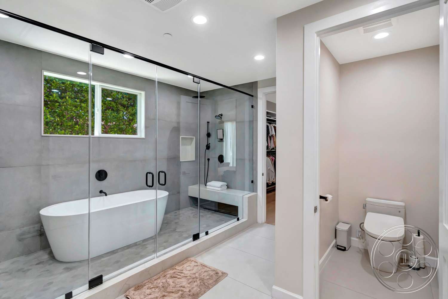 Modern 534 - neutral color palette, recessed lighting, minimalist design, freestanding bathtub, glass shower enclosure, wall-mounted faucet, modern bathroom fixtures, interior bathroom, white painted walls, concrete wall finish, tile bathroom flooring, floating bench, wide window for natural light
