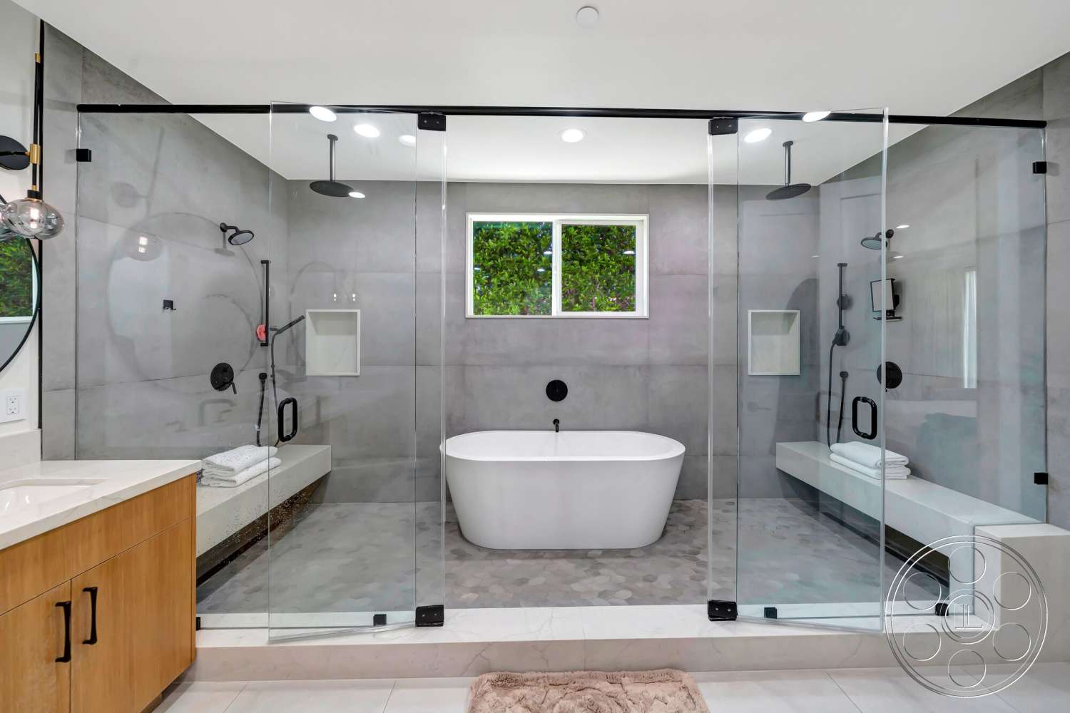 Modern 534 - neutral color palette, recessed lighting, wood cabinetry, freestanding bathtub, glass shower enclosure, concrete walls, interior bathroom, marble bathroom flooring, large window with outdoor view, floating bench, black plumbing fixtures