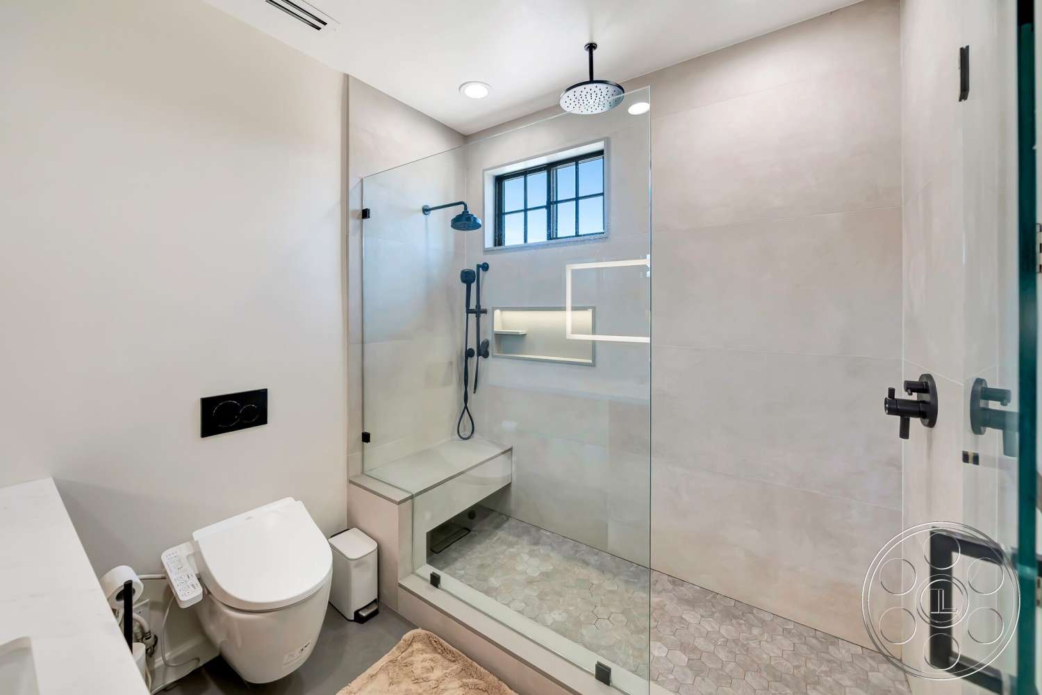 Modern 534 - contemporary style, textured plaster walls, sleek countertop, hexagonal tile flooring, rain shower head, glass shower doors, built-in shower niche, marble bathroom flooring, modern toilet, framed window in shower, black matte fixtures, walk-in shower enclosure, dimensional lighting