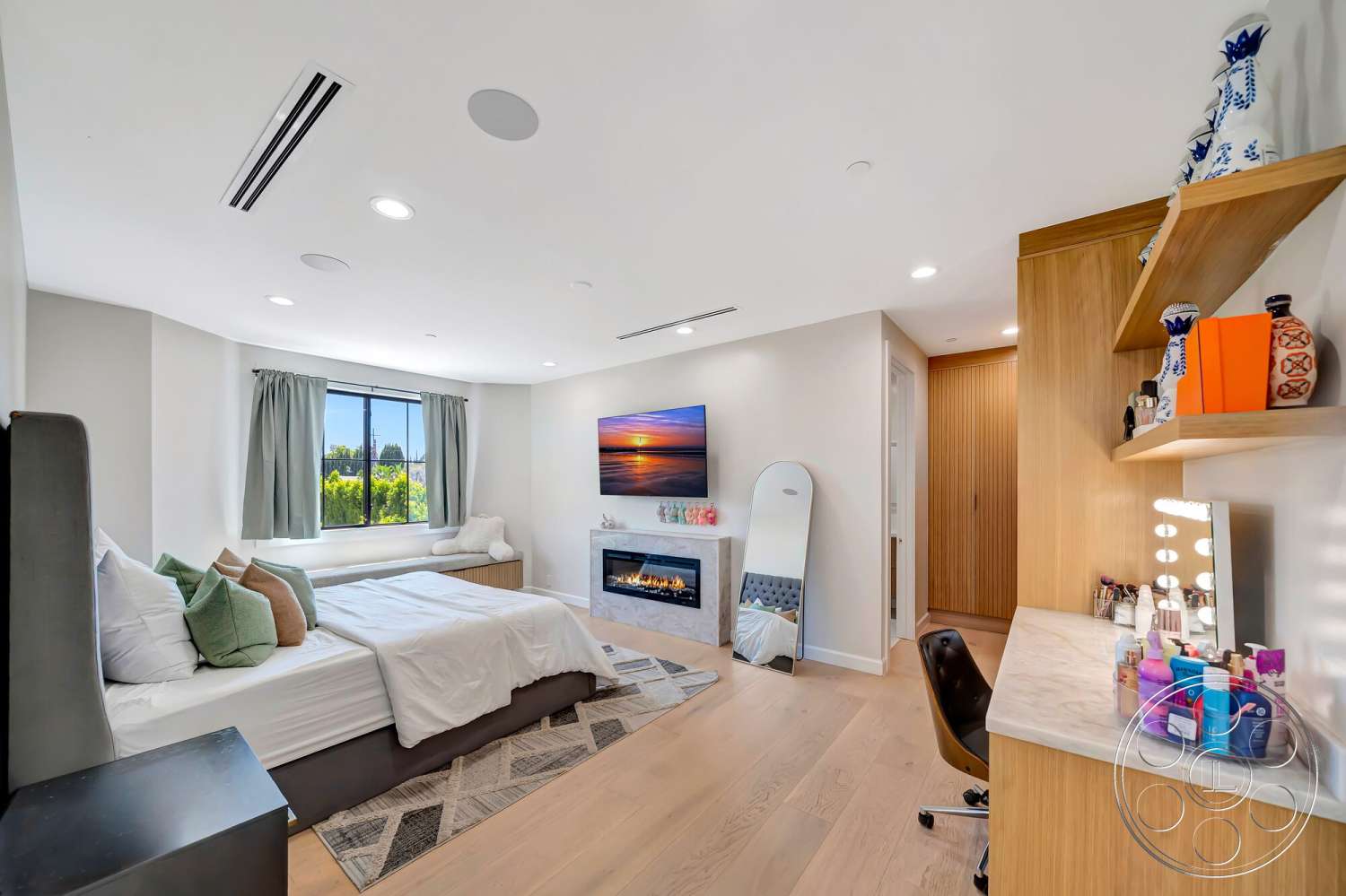 Modern 534 - minimalist decor, neutral color palette, recessed lighting, wall-mounted television, wood shelving, floor-to-ceiling windows, geometric area rug, fabric curtains, hardwood bedroom floors, modern bed frame, exposed wood paneling, upholstered accent chair, modern electric fireplace, marble vanity top, makeup mirror with lights