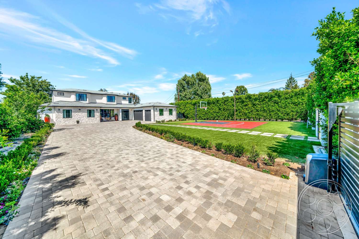 Modern 534 - large windows, exterior, paver driveway, basketball court, modern architectural style, grey stone walls, two-story home, landscaped garden beds, rectangular patio layout, synthetic grass lawn
