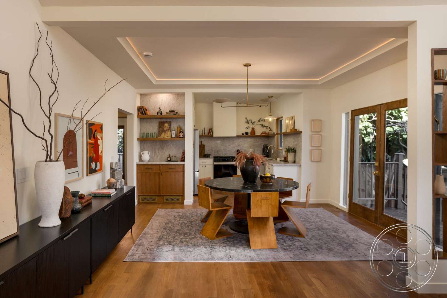 Craftsman 65 - neutral color palette, hardwood flooring, textured area rug, decorative vases, modern pendant lighting, artwork on walls, wooden dining table, floor-to-ceiling windows, black cabinetry, recessed ceiling lighting, white painted walls, plant accent, open shelving units, marble dining table top, double wood doors, kitchen area with marble backsplash, living space with natural lighting