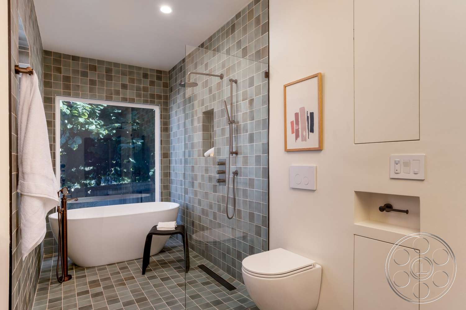 Craftsman 65 - freestanding bathtub, glass shower enclosure, framed wall art, textured tile flooring, natural light from large window, minimalist bathroom design, subway tile bathroom walls, modern bathroom faucet, dark wood accent details, white-painted cabinetry
