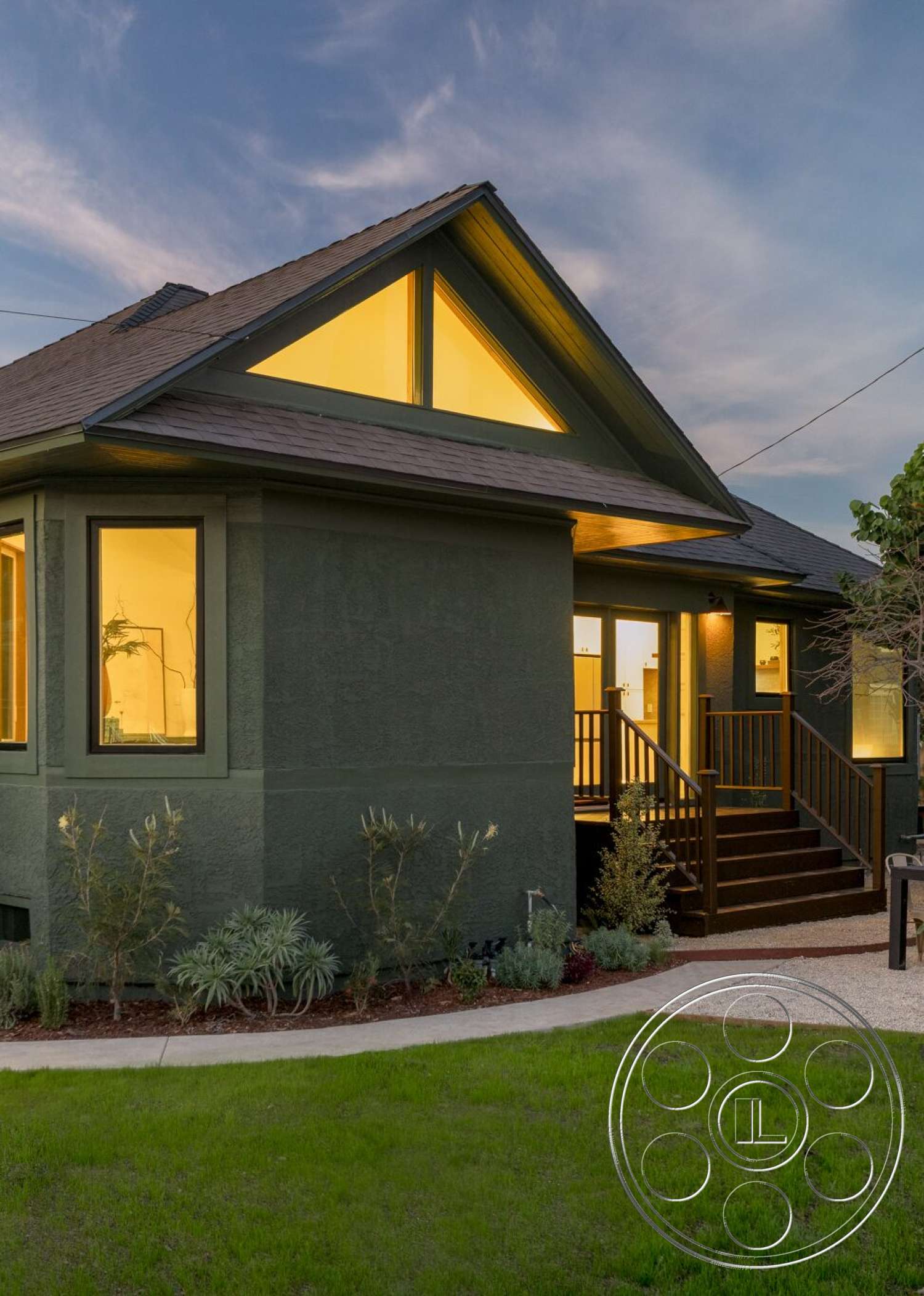 Craftsman 65 - large windows, exterior, green landscaping, sloped roof, gravel pathway, stucco walls, dusk lighting, modern home design, wooden front steps, triangular gable