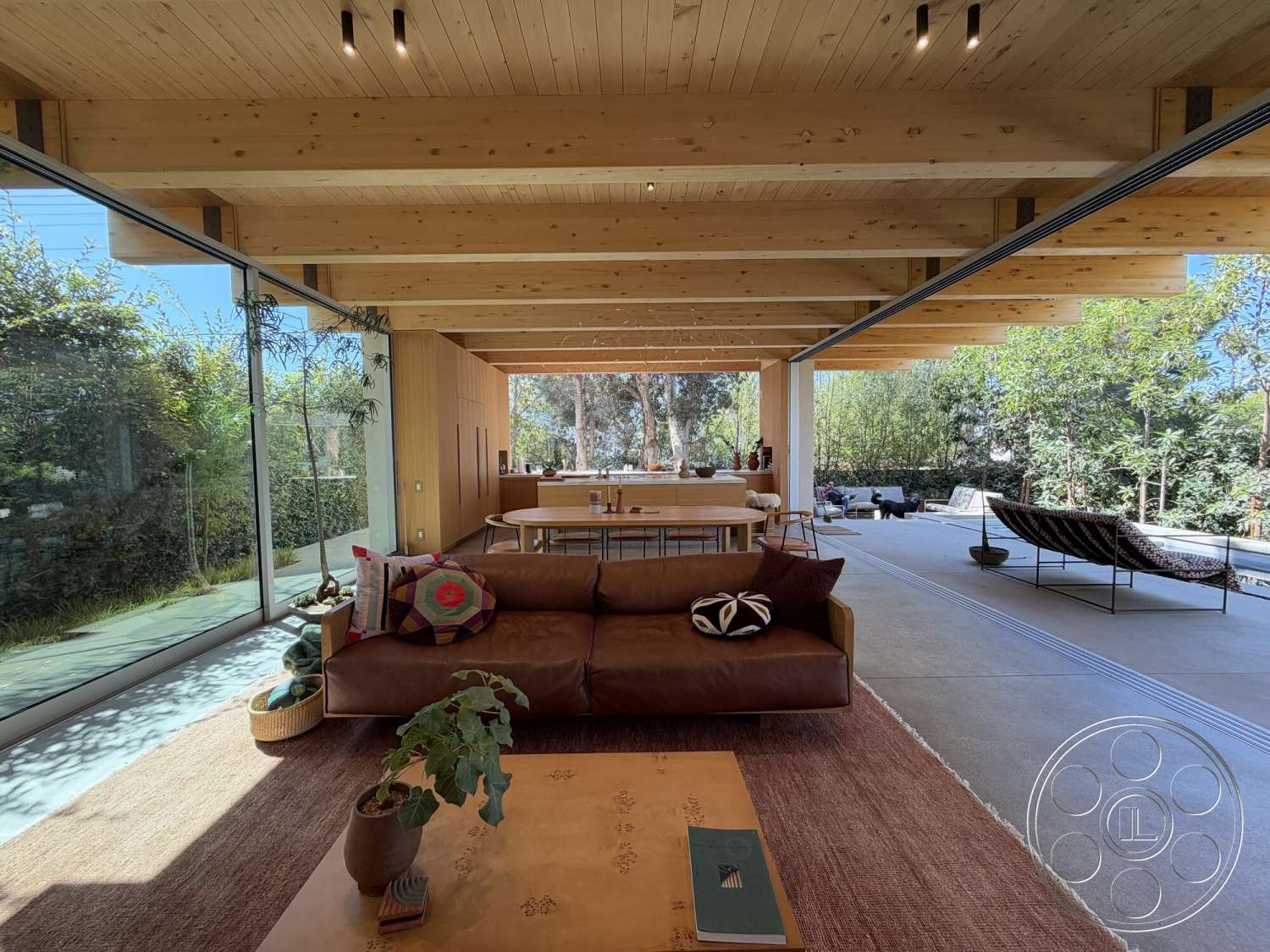 Retro House - minimalist decor, natural light, exterior, contemporary design, indoor plants, textured area rug, open floor plan, modern furniture, concrete flooring, surrounding greenery, floor-to-ceiling windows, cozy living room, wood beam ceiling, glass wall panels, spacious kitchen area, light wood finish walls, architectural accents