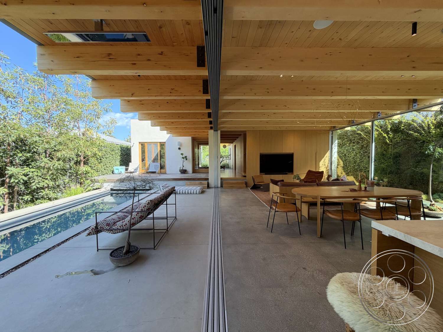 Retro House - natural light, exterior, open concept layout, rectangular swimming pool, floor-to-ceiling windows, light wood paneling, residential setting, minimalist architecture, contemporary outdoor seating, modern dining area, wood beam ceiling, concrete patio floor, stone garden landscaping, luminous interior