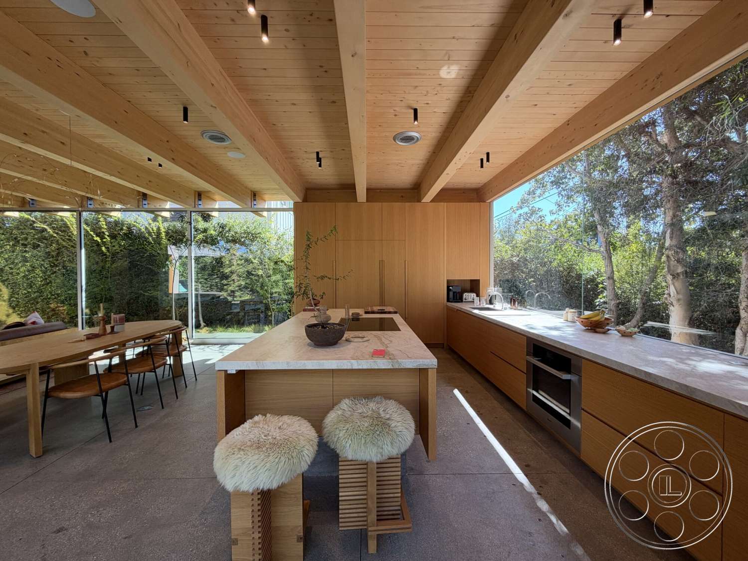 Retro House - minimalist decor, natural light, wood dining table, surrounded by greenery, metal dining chairs, modern kitchen design, open kitchen layout, marble kitchen island countertop, wood beam ceiling, built-in kitchen cabinets, floor-to-ceiling glass walls, concrete kitchen flooring