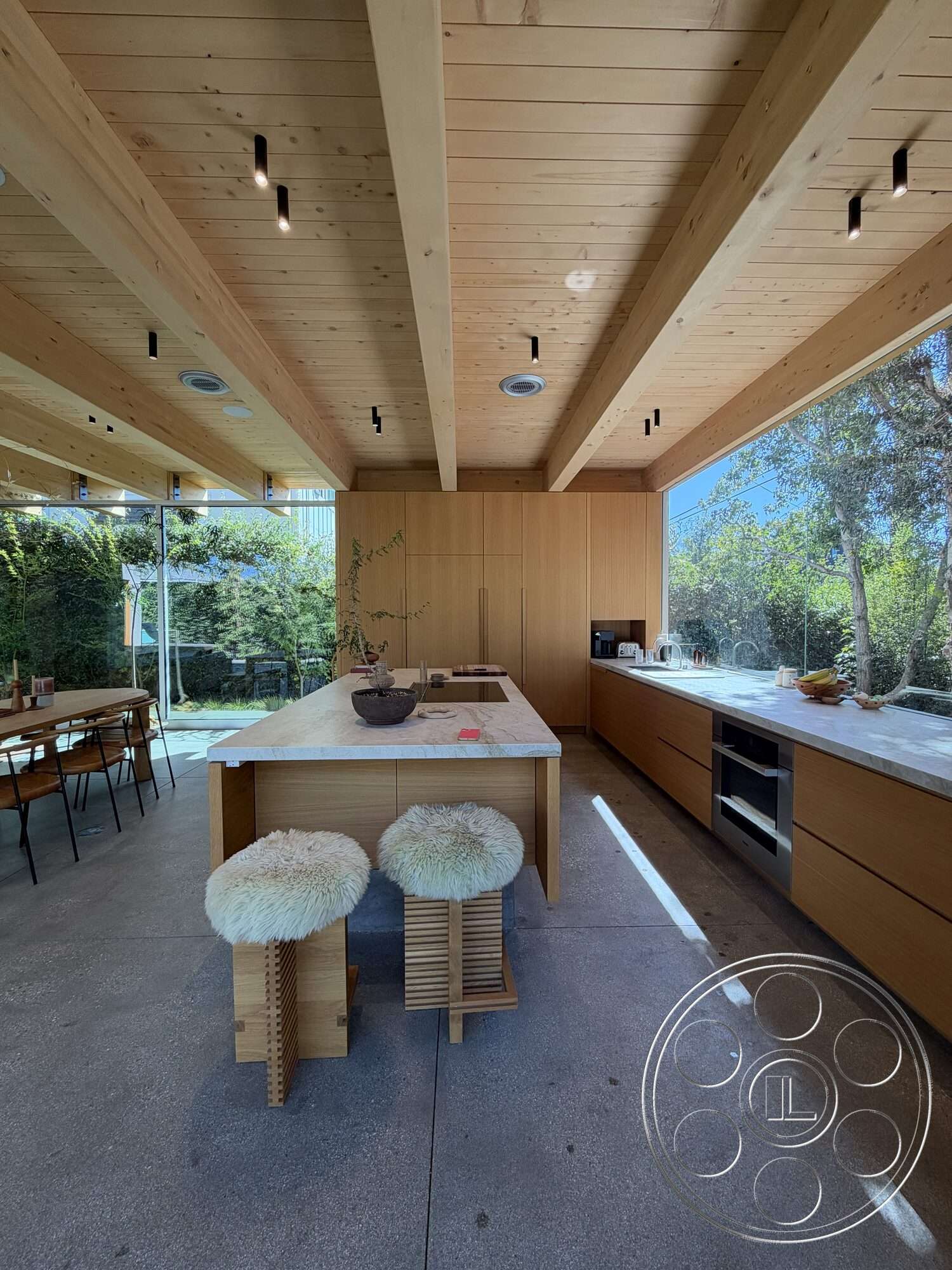 Retro House - open concept layout, wood dining table, floor-to-ceiling windows, modern farmhouse style, metal dining chairs, exposed wood ceiling beams, minimalist kitchen design, white painted walls, marble kitchen island, concrete kitchen floor, light hardwood kitchen cabinets