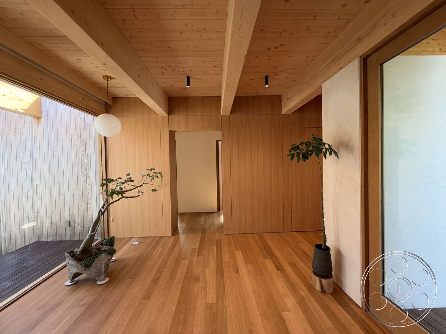 Retro House - hardwood flooring, modern pendant lighting, floor-to-ceiling windows, contemporary design elements, exposed wood ceiling beams, decorative indoor plants, smooth oak planks, minimalist wooden wall panels