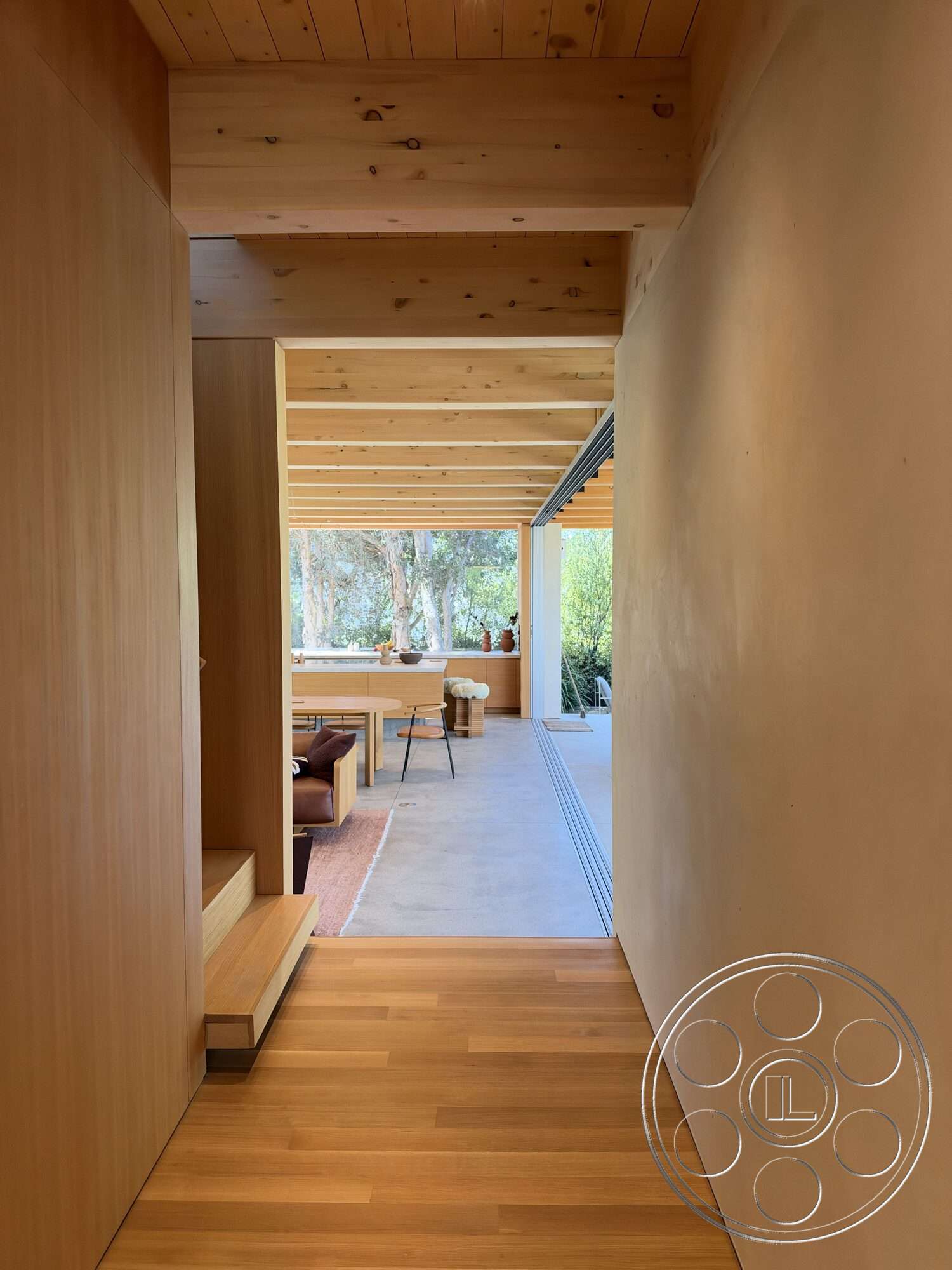 Retro House - exterior, open floor plan, floor-to-ceiling windows, contemporary architecture, textured plaster walls, modern dining space, wood beam ceiling, concrete patio floor, bright interior lighting, minimalist entryway design, hardwood hallway flooring, transitional indoor-outdoor space, natural wood wall panels, functional furniture arrangement
