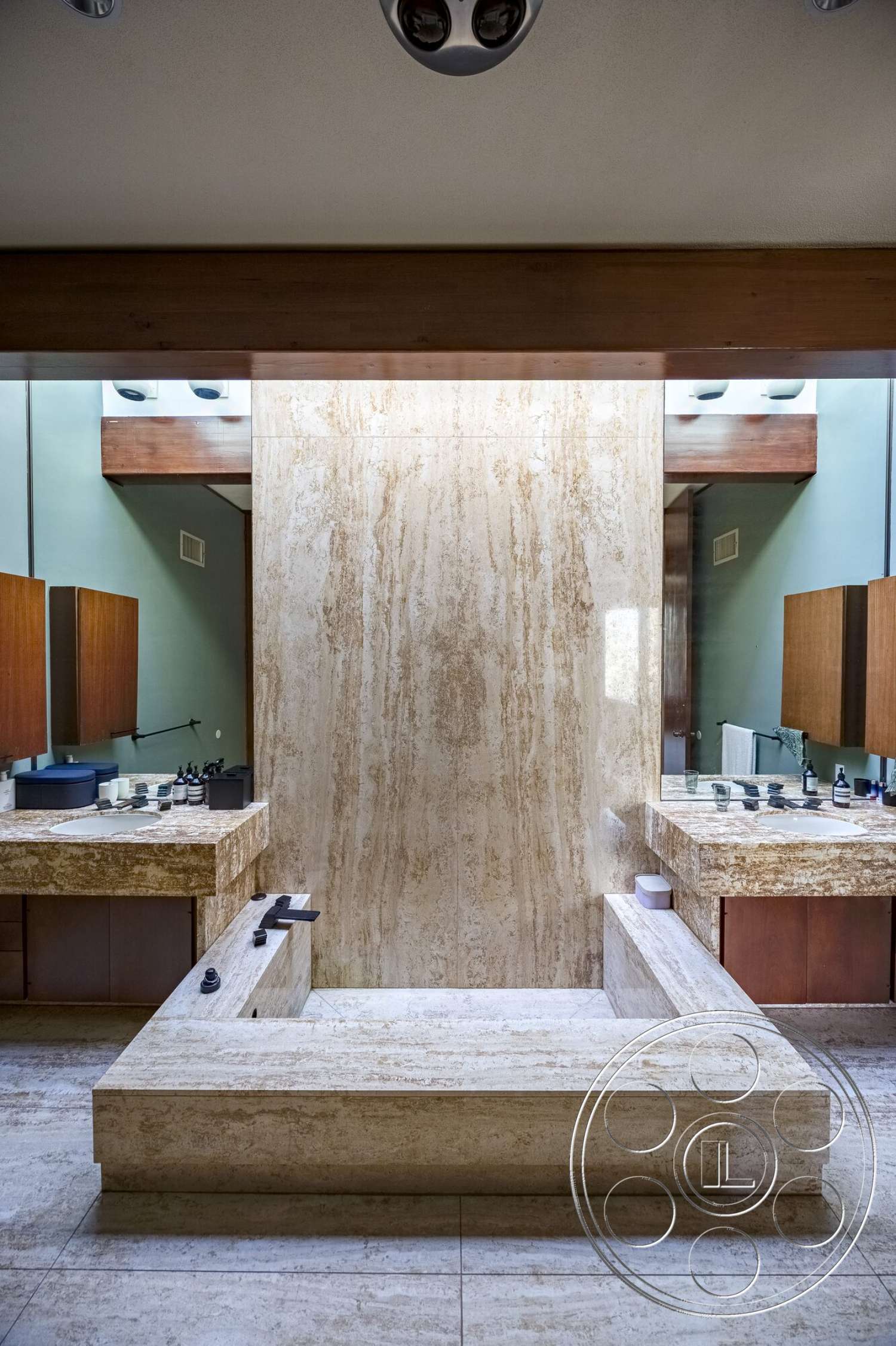 MCM 29 - wood cabinetry, double sink vanity, exposed wood ceiling beams, modern bathroom design, marble bathroom flooring, marble wall feature, vanity with integrated storage