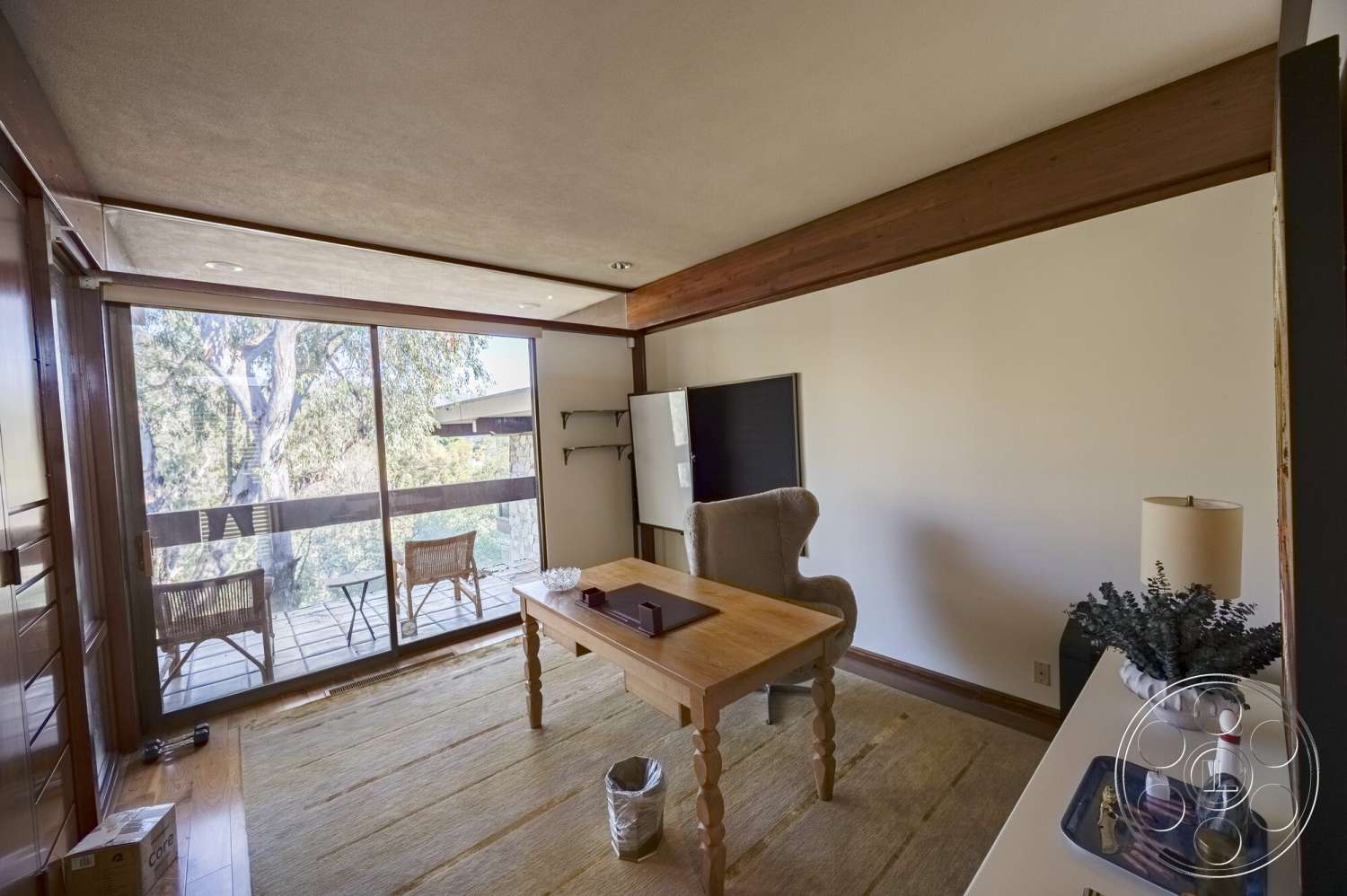 MCM 29 - neutral color palette, hardwood flooring, minimalist design, contemporary decor, glass sliding doors, wooden dining table, large windows for natural light, textured ceiling, exposed wood ceiling beams, white painted walls, indoor plants accents, woven armchairs