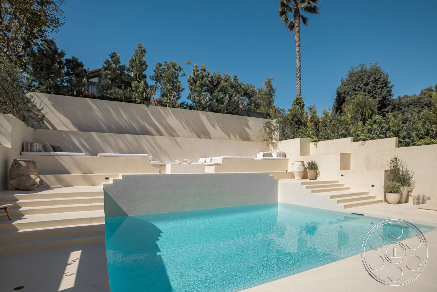 Modern 535 - exterior, landscaped garden, minimalist design, potted plants, surrounding greenery, concrete steps, rectangular pool, sunny outdoor setting, plaster wall, concrete patio flooring, concrete pool border, poolside sun loungers, horizontal seating area, azure water surface