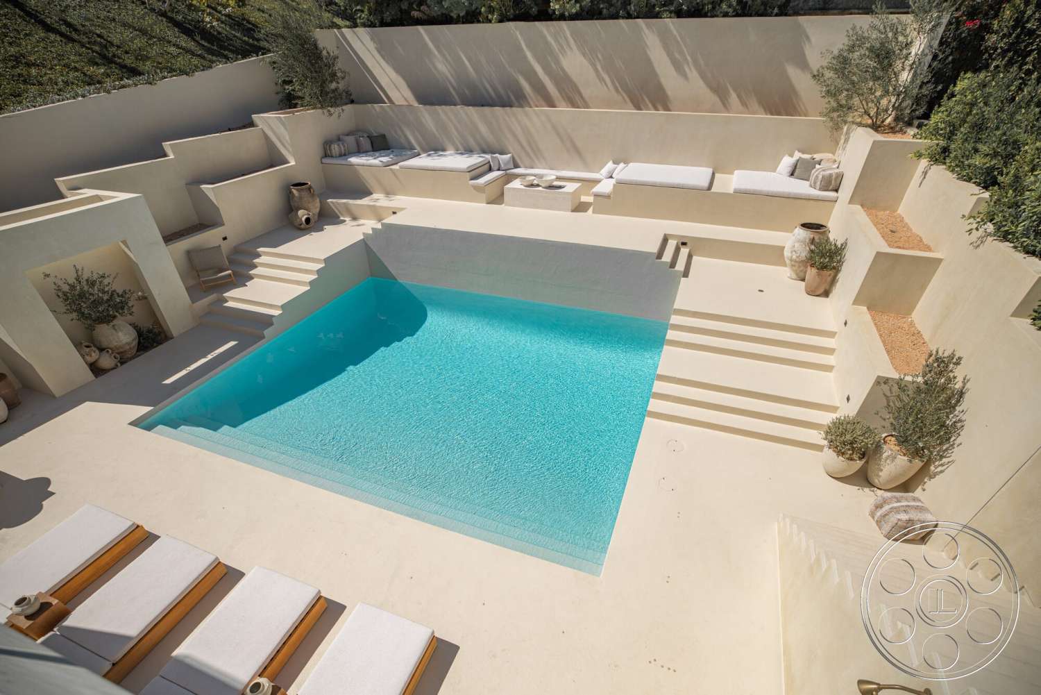 Modern 535 - concrete steps, outdoor lounge area, textured plaster walls, concrete pool deck, landscape greenery, rectangular pool, stone planters, natural light-filled space, built-in seating area, clean minimalist lines, stepped terrace design