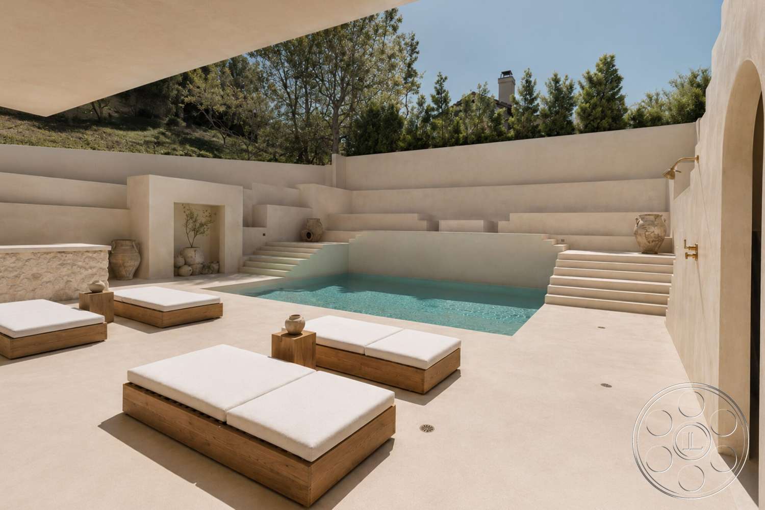 Modern 535 - exterior, rectangular swimming pool, wooden lounge chairs, landscaped garden setting, stucco wall finish, minimalist architectural style, concrete pool steps, stone water feature, concrete pool walls, light-colored concrete patio flooring
