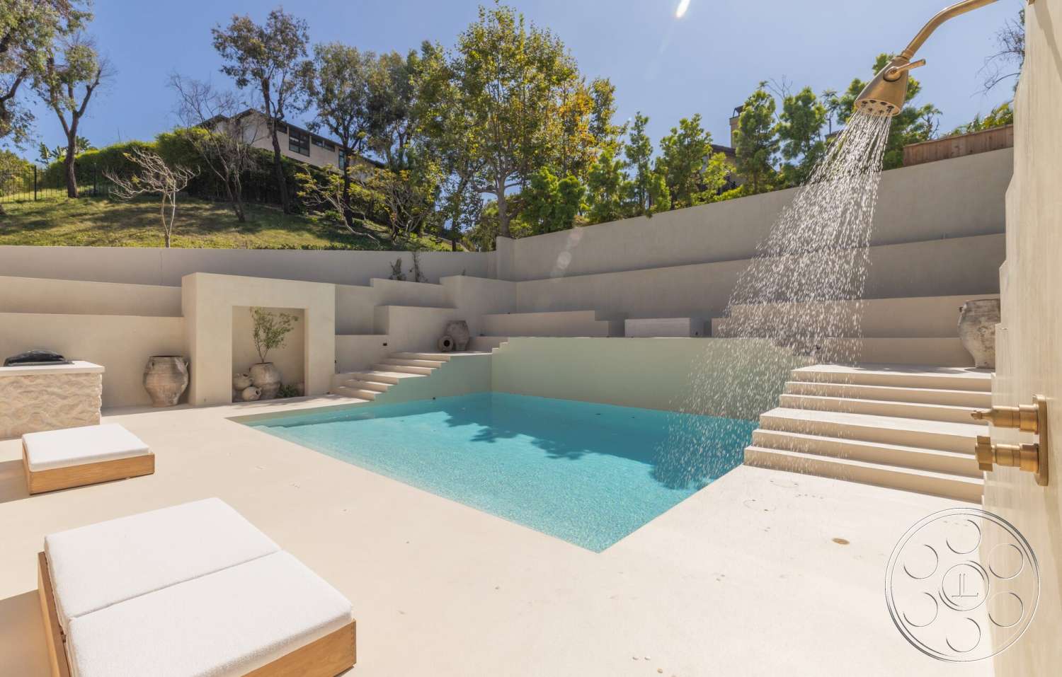 Modern 535 - exterior, minimalist design, concrete walls, concrete steps, planter with greenery, concrete pool deck, rectangular pool, wooden lounge chairs, exposed aggregate concrete, landscaped hillside setting, built-in outdoor shower