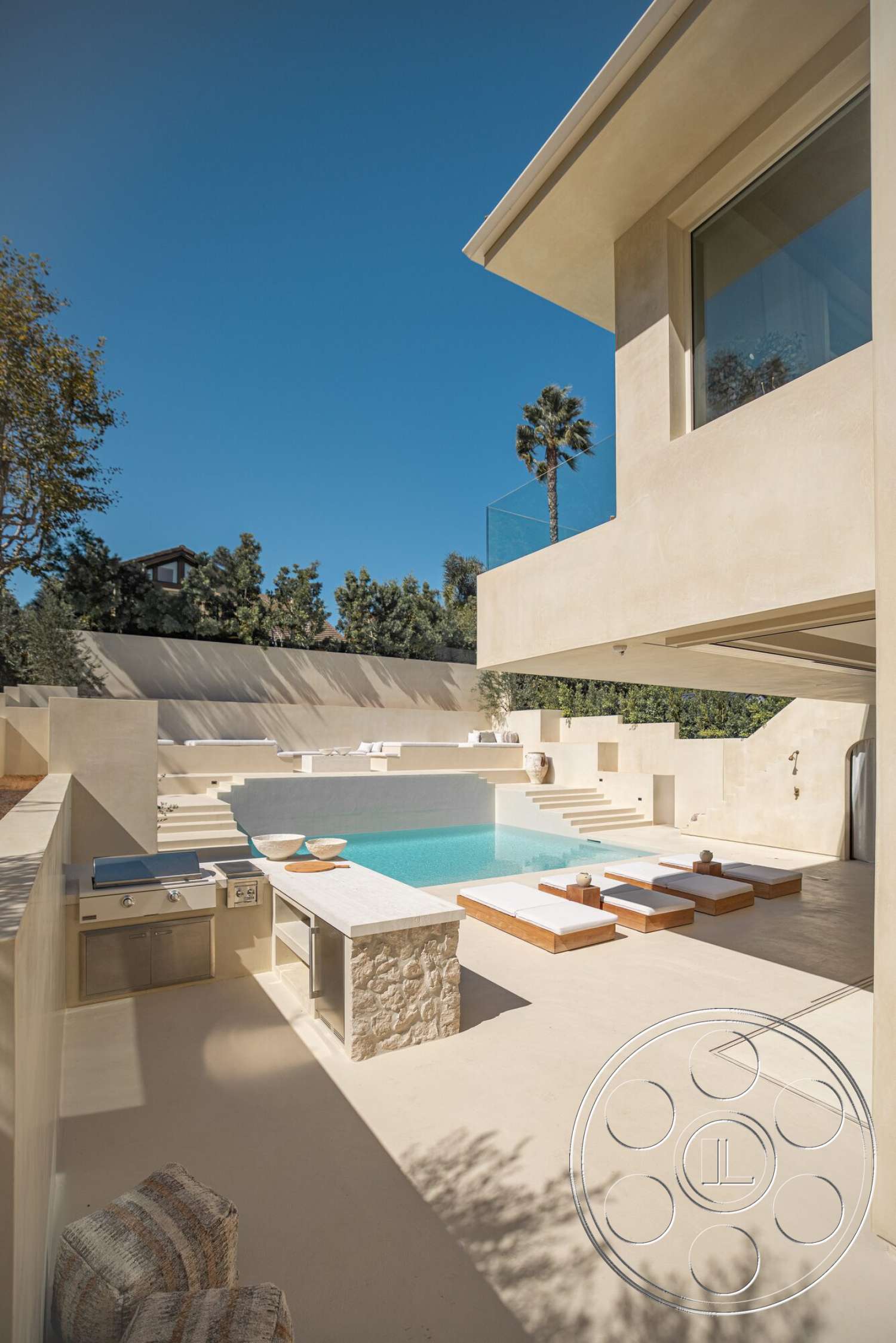 Modern 535 - exterior, minimalist design, glass railing, tropical landscaping, plastered walls, infinity pool, open-air concept, stone pool deck, concrete patio flooring, natural light emphasis, sleek architectural lines, sunny outdoor environment, stepped terrace, modern outdoor kitchen, hardwood sun loungers