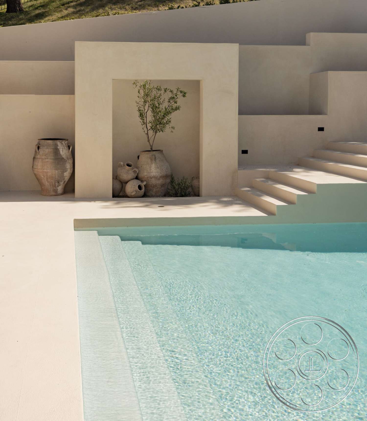 Modern 535 - exterior, minimalist design, concrete steps, clear water, textured plaster walls, concrete pool deck, rectangular pool, stone planters, natural landscape setting