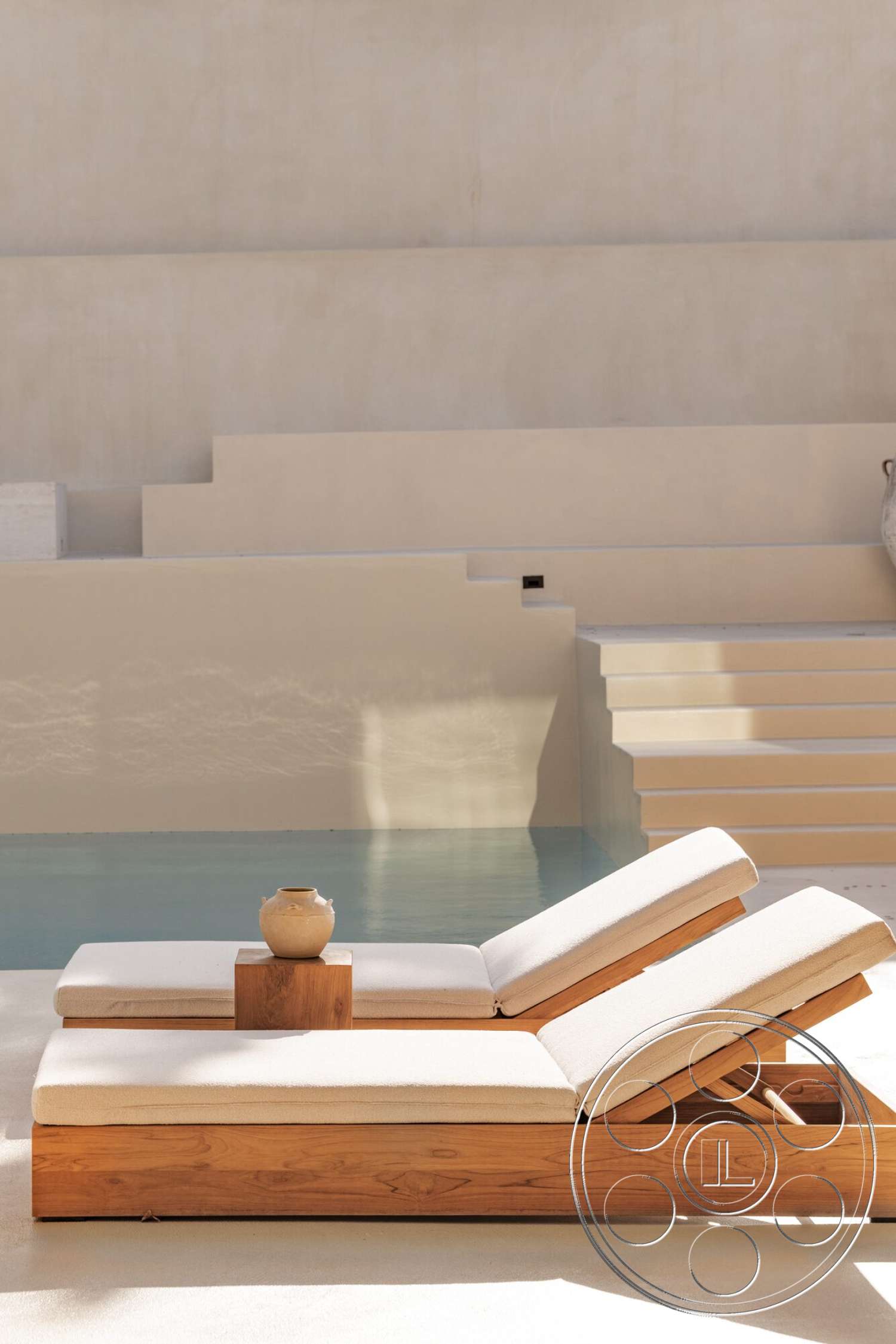 Modern 535 - minimalist design, exposed concrete wall, rectangular swimming pool, textured plaster wall, modern outdoor setting, concrete pool steps, wood lounge chairs, beige fabric cushions