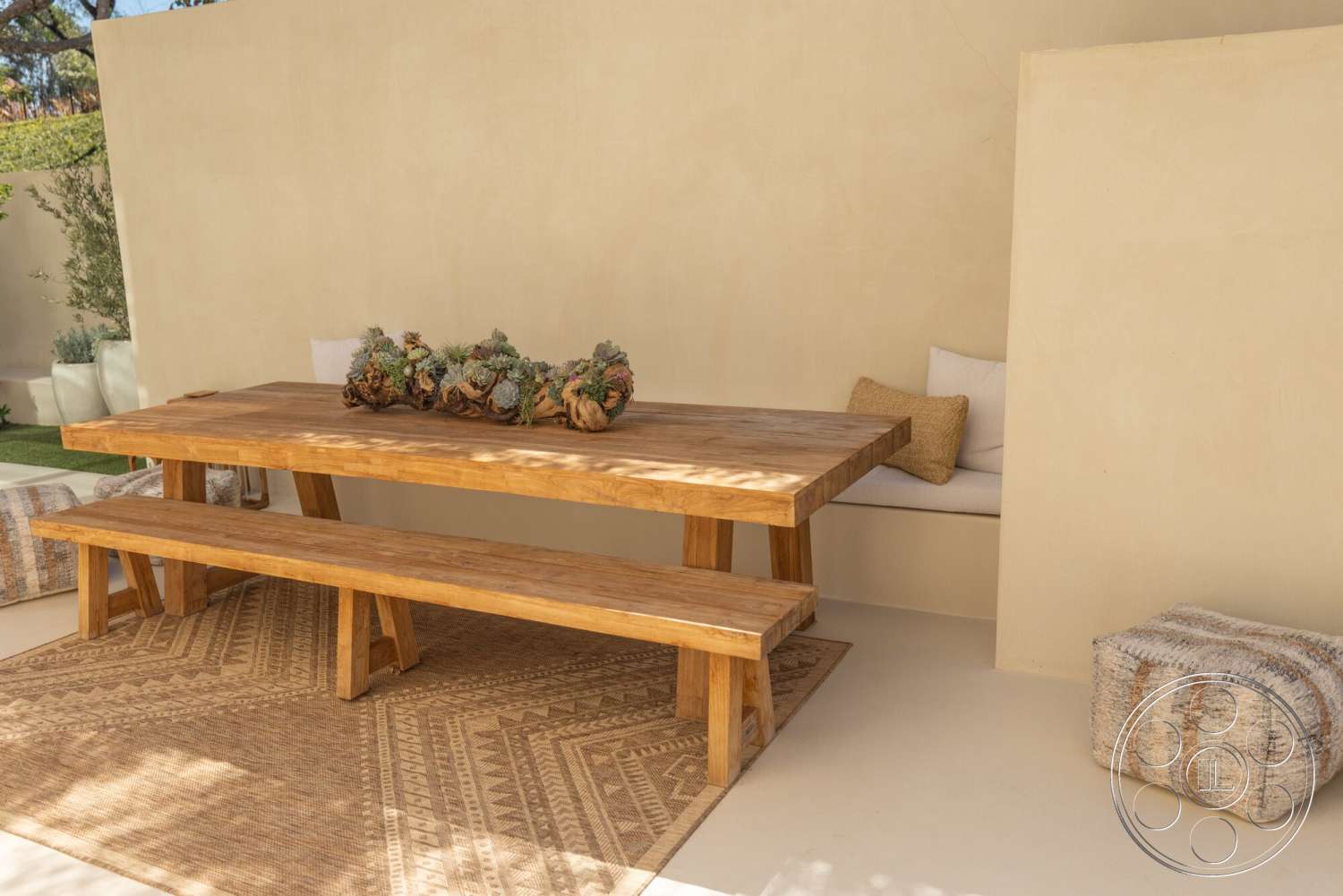 Modern 535 - neutral color palette, exterior, minimalist design, wood dining table, textured plaster walls, natural outdoor setting, concrete patio floor, woven rug flooring, light wood bench seats, built-in seating nook