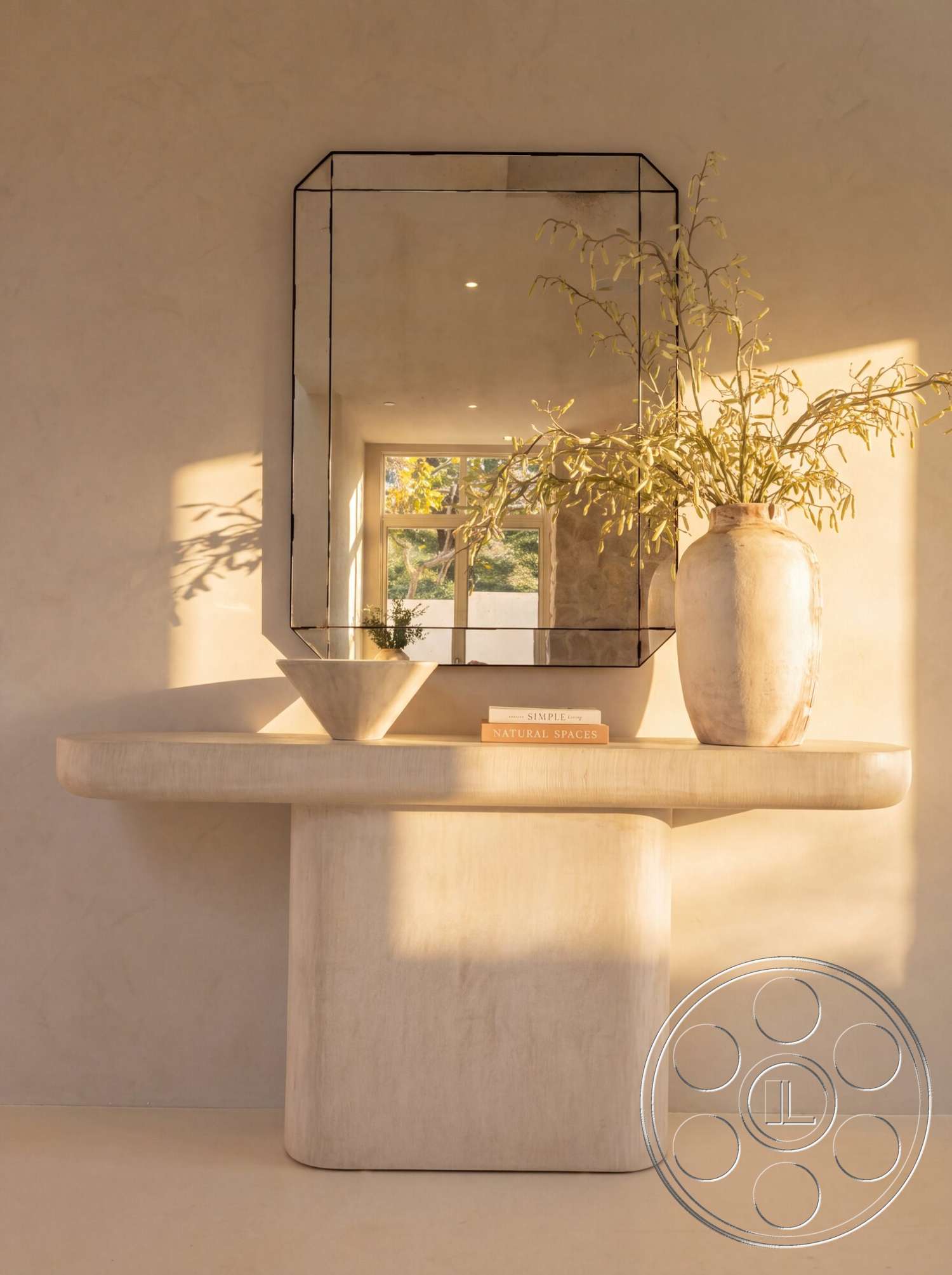 Modern 535 - minimalist decor, neutral color palette, natural light, rectangular mirror, soft shadows, textured plaster walls, ceramic vase, decorative bowl, concrete console table