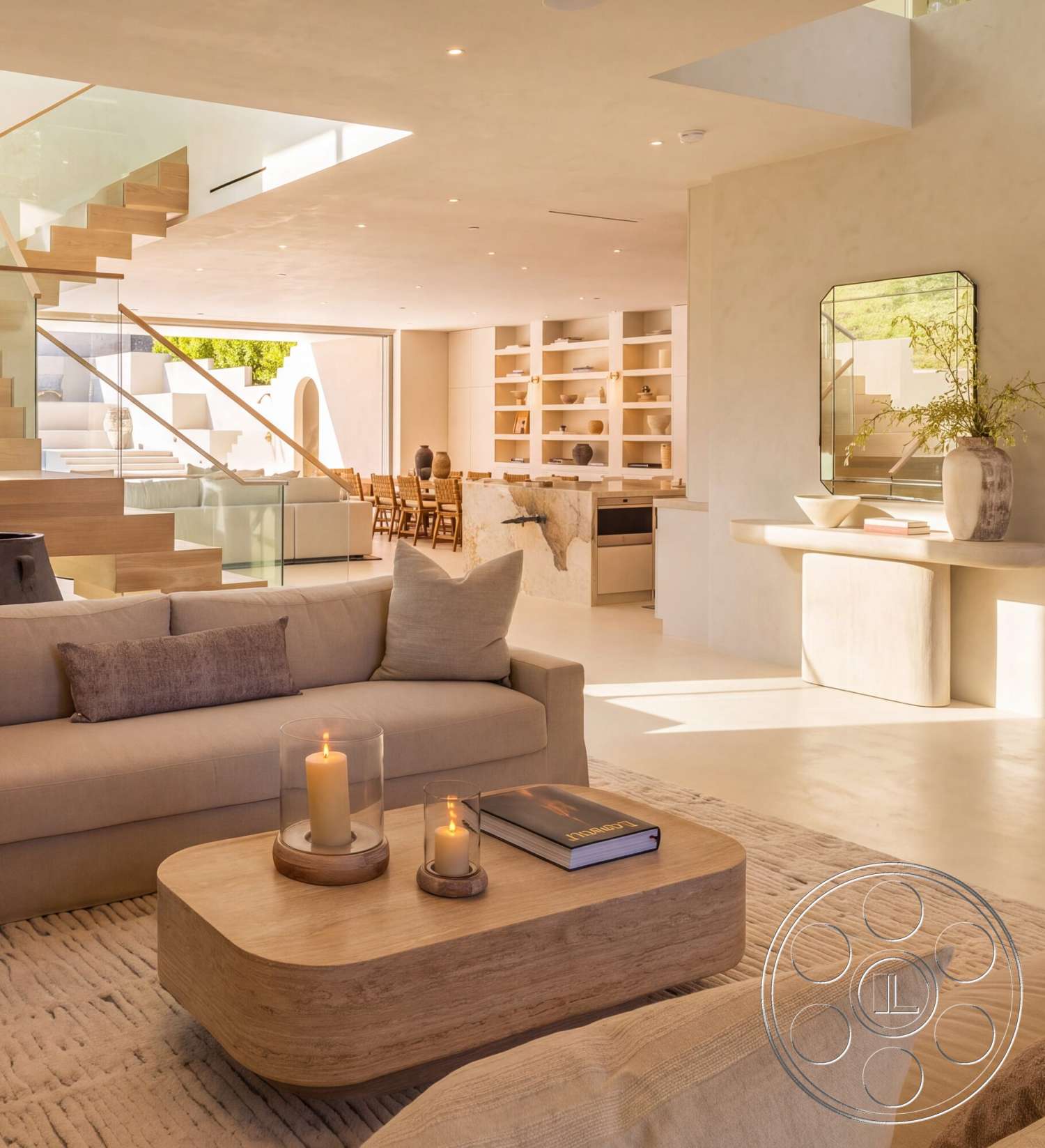 Modern 535 - minimalist decor, wood dining table, large windows for natural light, wooden staircase, concrete floors, neutral wall color, woven area rug, textured plaster walls, vase with greenery, glass stair railing, modern sofa, open shelving units, stone kitchen countertop, cushioned throw pillows