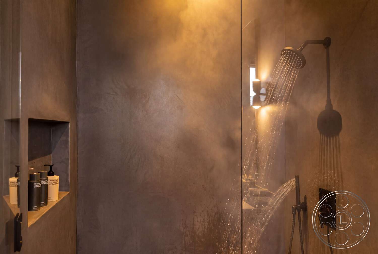 Modern 535 - glass shower enclosure, textured plaster walls, interior shower space, recessed shower niche, modern shower head, wall-mounted bathroom lighting, dark marble flooring