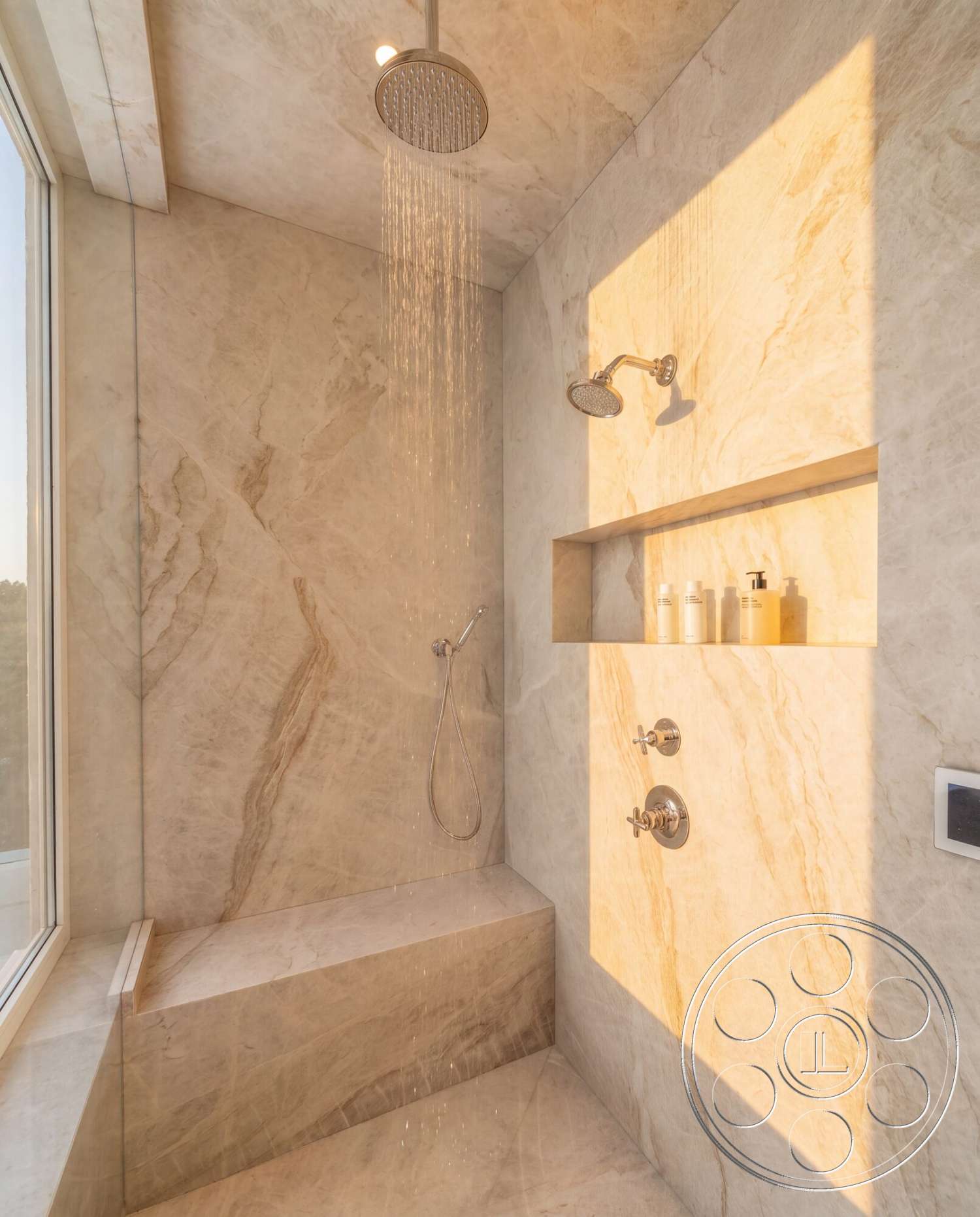 Modern 535 - recessed lighting, glass shower enclosure, chrome shower fixtures, built-in shower niche, marble shower walls, marble shower bench, waterfall showerhead