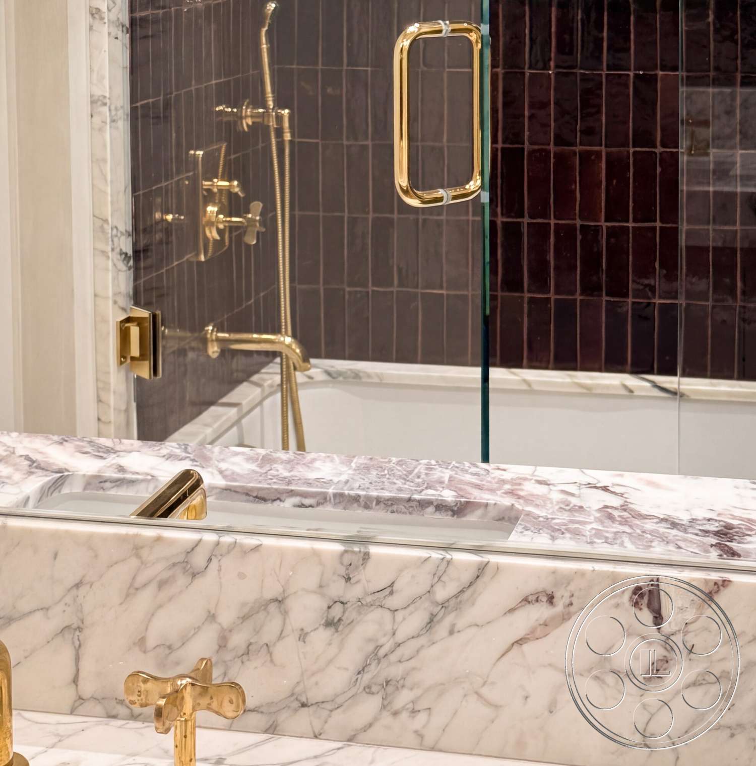 Modern 535 - freestanding bathtub, glass shower enclosure, marble bathroom countertop, brass faucet fixtures, textured tile shower walls, dark tile accent wall, golden shower hardware