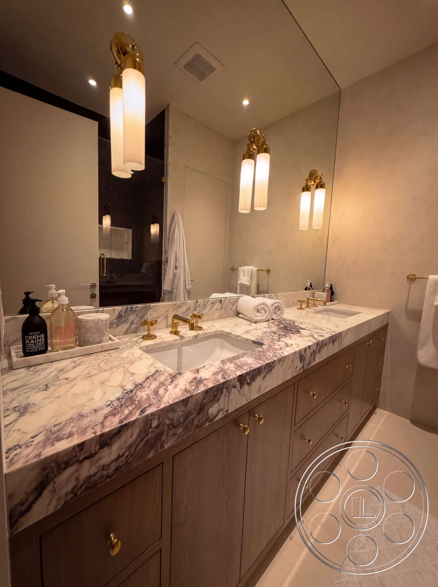 Modern 535 - contemporary style, light wood cabinetry, textured plaster walls, gold faucet fixtures, modern bathroom design, recessed LED ceiling lights, marble bathroom countertop, white towel rack, oval sink basin, hanging glass pendant lights, soft gray floor tiles