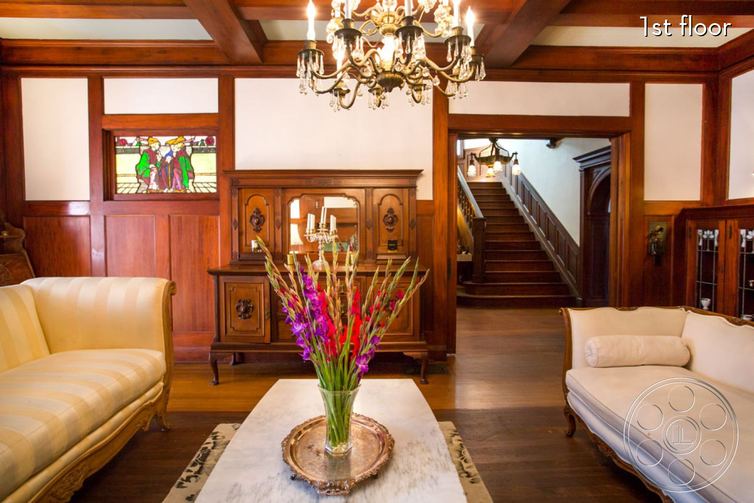The Rosenheim Mansion - indoors, furniture, room, wood, lamp, living room, hardwood, couch, lighting, chandelier, flower, flower arrangement, blossom