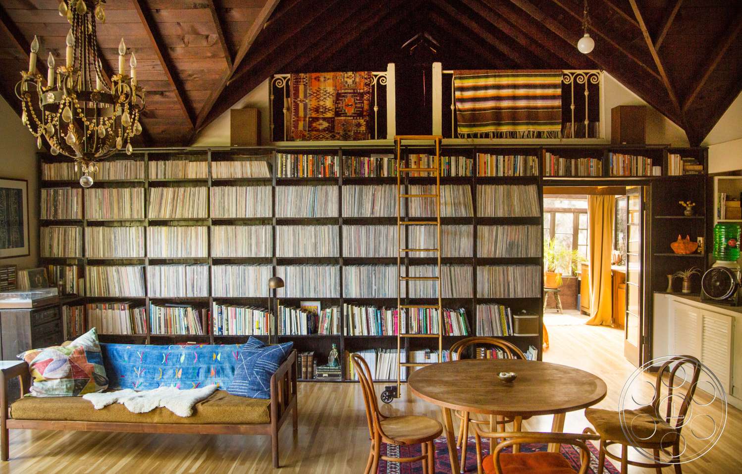 Bohemian 2 - indoors, furniture, room, chair, table, wood, lamp, plywood, hardwood, library, book, bookcase, chandelier, dining table, records